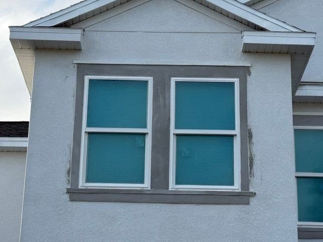 Window surround primed for exterior paint