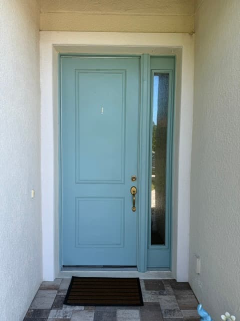 Entry door before staining — original finish